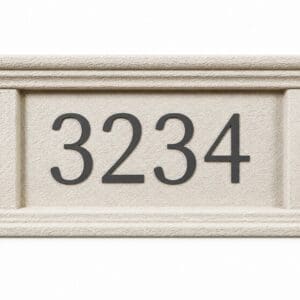 A Tuscan style Address Plaque mounted on a stucco textured wall showcases the number 1800 in large, bold silver numerals with subtle black outlines and features a decorative border with a classic, elegant style.