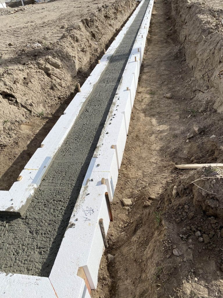 SnapTight Products FasTrax footing concrete form filled with concrete