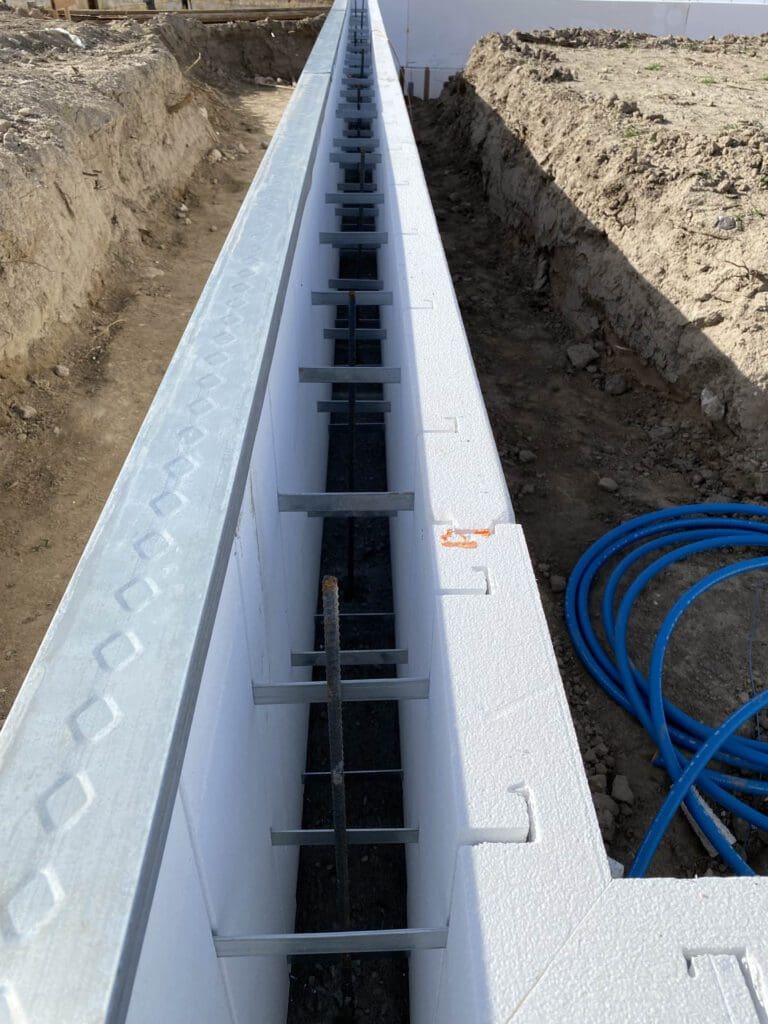 SnapTight Products FasTrax Stem Wall Form – lightweight, insulated form system designed for fast, accurate concrete stem wall installation