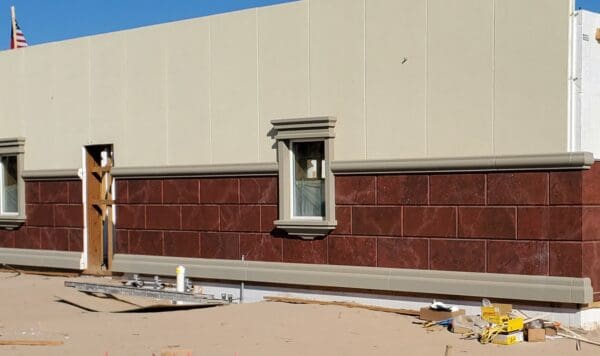 Prefabricated stucco wall panels ready for installation, showcasing durable and energy-efficient construction solutions. These panels are designed for quick assembly, reducing on-site labor and costs, while providing a sleek, finished look for exterior and interior applications.