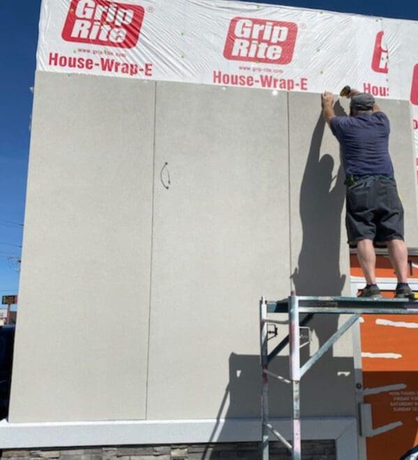Prefabricated stucco wall panels ready for installation, showcasing durable and energy-efficient construction solutions. These panels are designed for quick assembly, reducing on-site labor and costs, while providing a sleek, finished look for exterior and interior applications.
