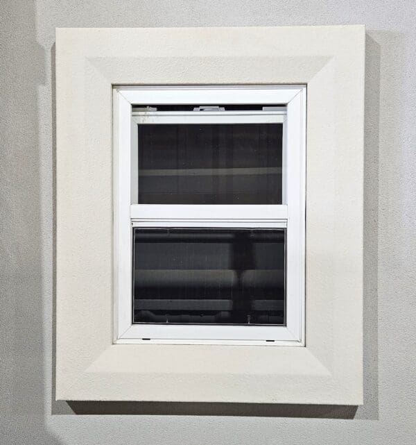 EPS exterior window trim featuring clean, symmetrical lines and decorative molding for enhanced curb appeal.