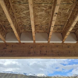 Insulated I-Block designed to fit between floor truss joists, providing thermal and acoustic insulation with high-density foam construction.