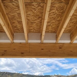 Insulated I-Block designed to fit between floor truss joists, providing thermal and acoustic insulation with high-density foam construction.