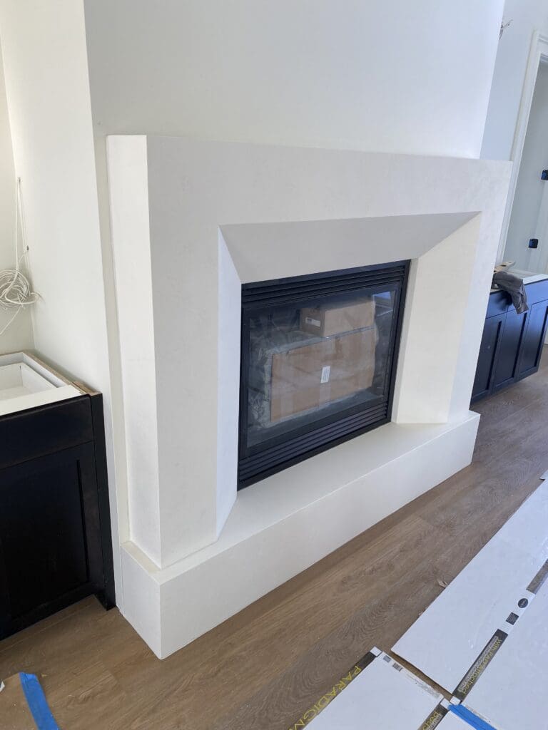 Realistic faux fireplace mantle by SnapTight Products, crafted from lightweight EPS for decorative charm and easy installation.