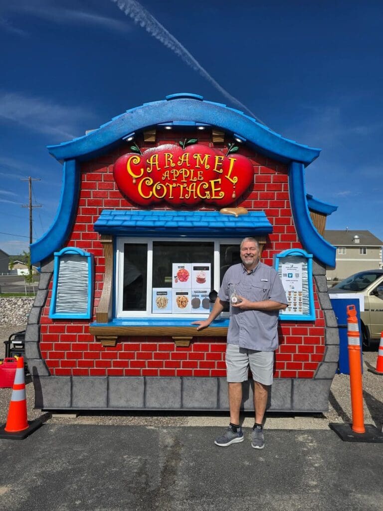 Charming caramel apple cottage-themed trailer kiosk built by SnapTight Products