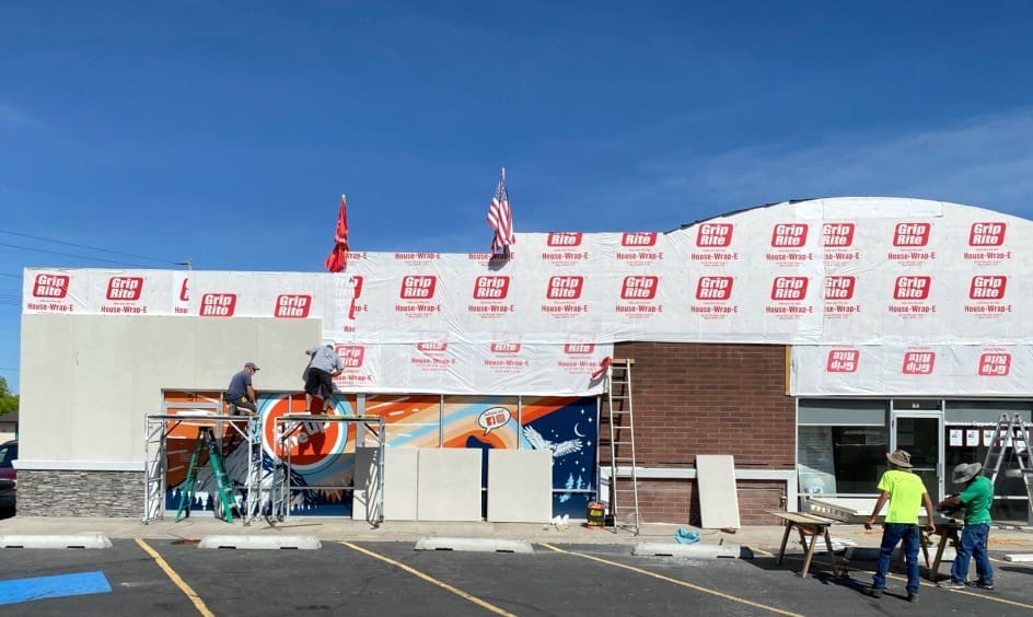Prefabricated stucco insulated siding panels showcasing durable and energy-efficient construction solutions. These panels are designed for quick assembly, reducing on-site labor and costs, while providing a sleek, finished look for exterior applications.