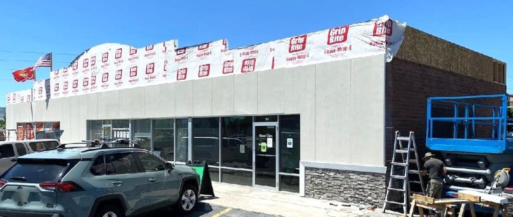 Prefabricated stucco insulated siding panels showcasing durable and energy-efficient construction solutions. These panels are designed for quick assembly, reducing on-site labor and costs, while providing a sleek, finished look for exterior applications.