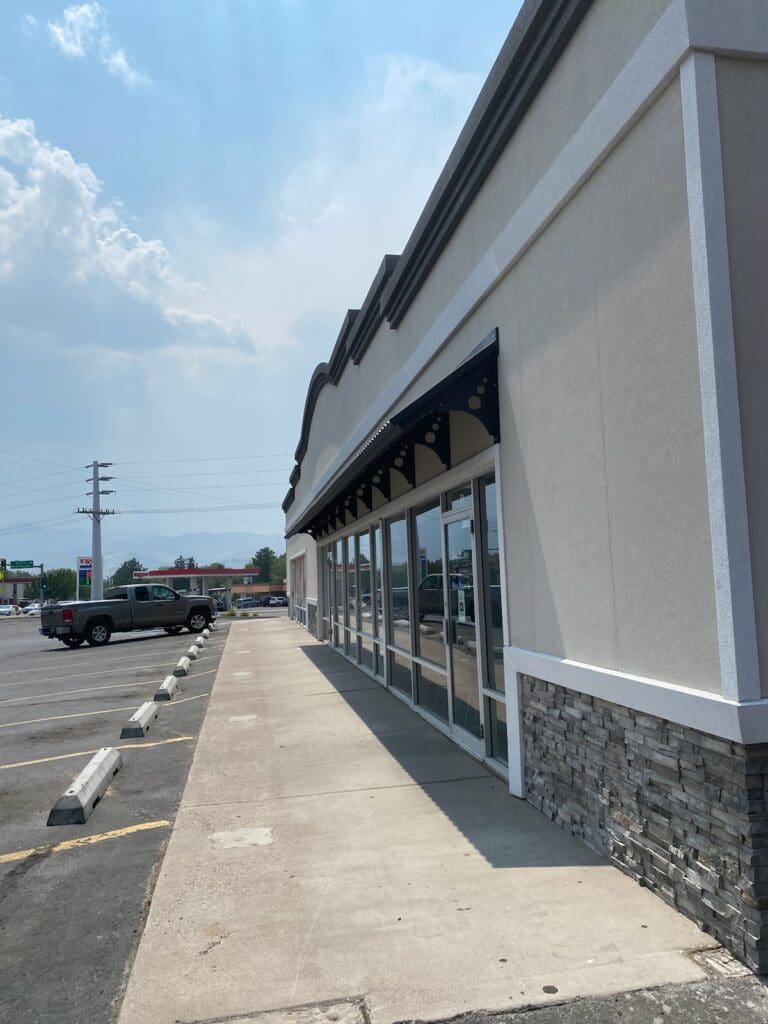 Prefabricated stucco insulated siding panels showcasing durable and energy-efficient construction solutions. These panels are designed for quick assembly, reducing on-site labor and costs, while providing a sleek, finished look for exterior applications.