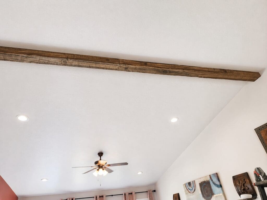 Faux wood beams installed on ceiling.