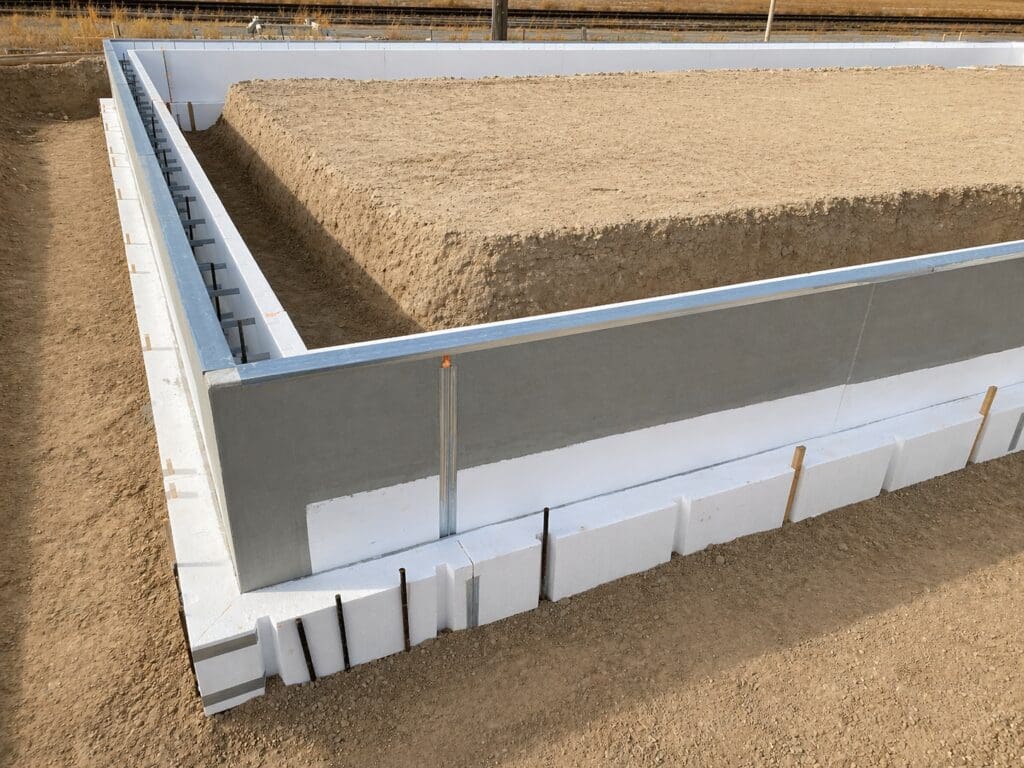FasTrax footing and stem wall forms with built-in insulation designed for fast, stay-in-place foundation construction
